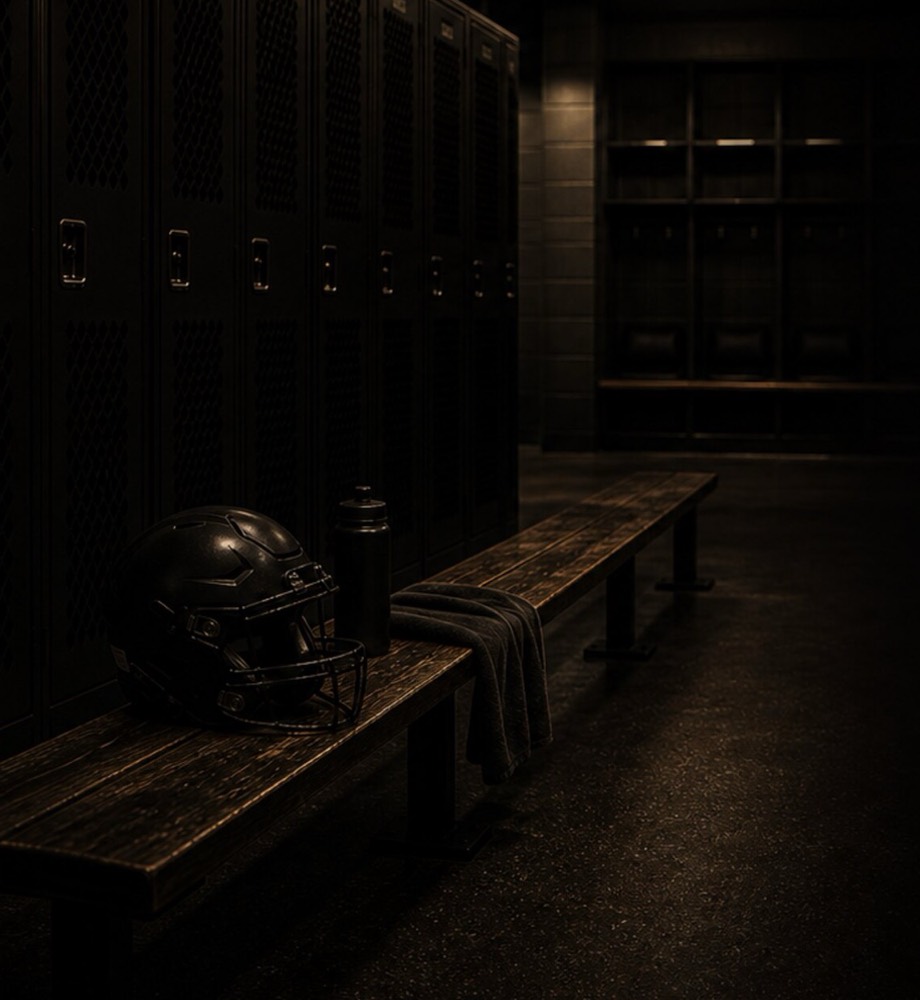Football helmet, bottle, and towel resting on a locker-room bench